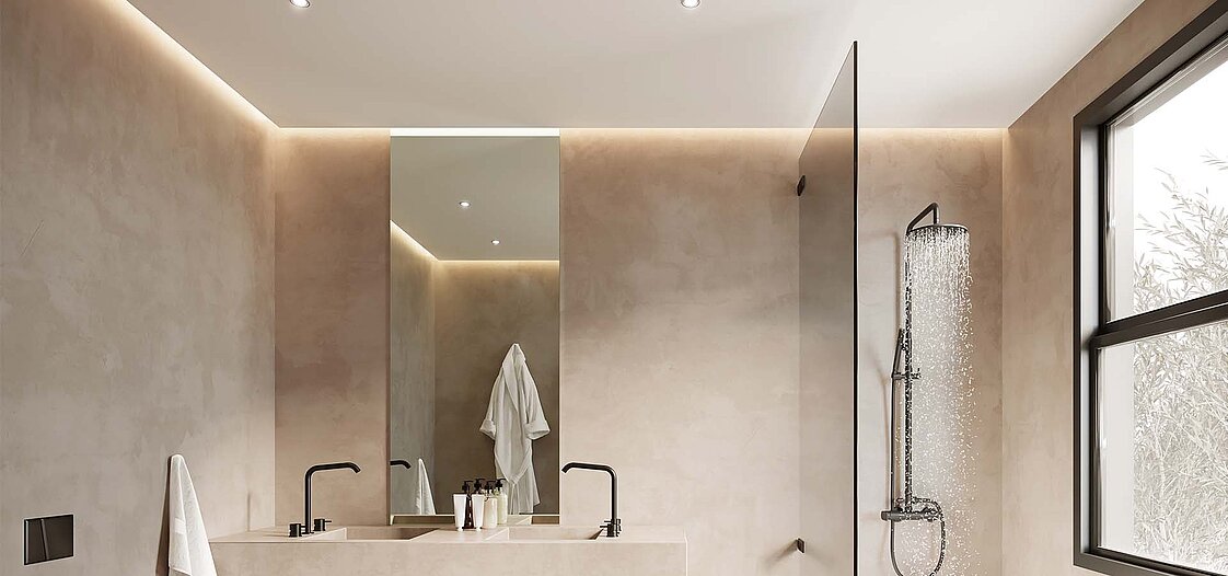 Ein Foto von einem hellen Badezimmer in beigen Farben und mit schwarzen Amaturen.